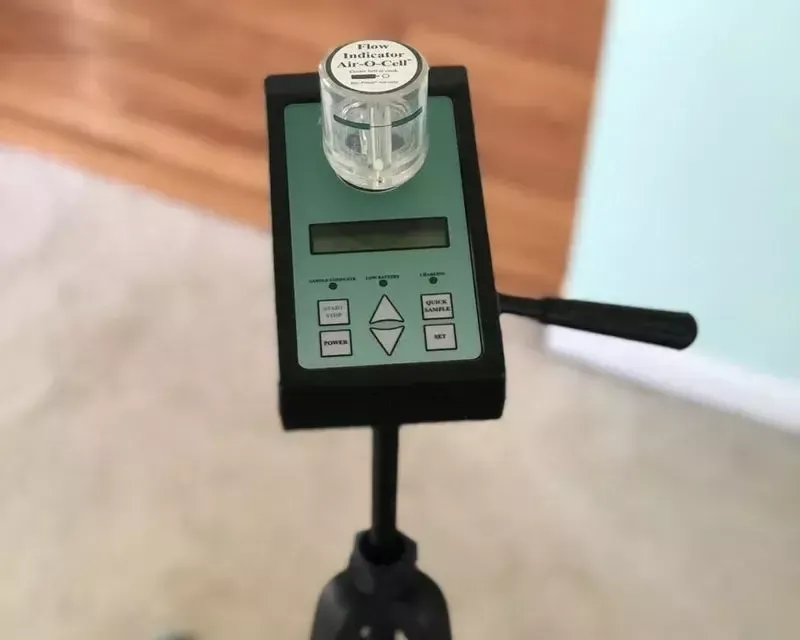 Air-O-Cell spore-trap air sampling pump on a tripod during a mold inspection